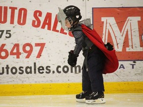 Little Superhero flies down the ice, at the Bradford District Skating Club's Halloween Skate at the BWG Leisure Centre in Bradford, Ont. on Saturday October 31, 2015. Miriam King/Bradford Times/Postmedia Network