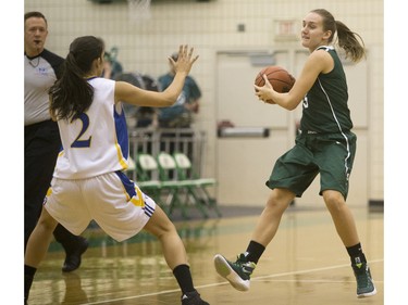 University of Saskatchewan Huskies forward Megan Lindquist moves the ball against the University of British Columbia Thunderbirds in Women's CIS Basketball action, November 21, 2015.