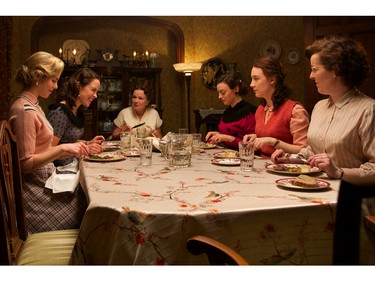 Julie Walters as Mrs. Kehoe (3L) and Saoirse Ronan as Eilis Lacey (2R) in "Brooklyn."