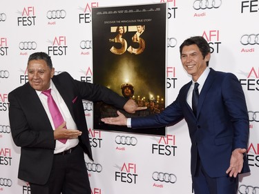 Former Chilean miner Luis Urzua (L) and "The 33" cast member Lou Diamond Phillips pose together at a gala screening of the film during the 2015 AFI Fest at the TCL Chinese Theatre in Los Angeles, November 9, 2015. Phillips plays Urzua in the film.
