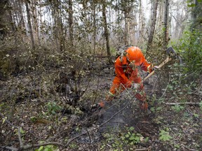 Canadian forces members air in forest fire fighting at Montreal Lake.