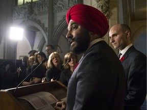 Minister of Families, Children and Social Development Jean-Yves Duclos looks on as Innovation, Science and Economic Development Minister Navdeep Bains responds to a question in the Foyer of the House of Commons on Parilament Hill in Ottawa Thursday, November 5, 2015.