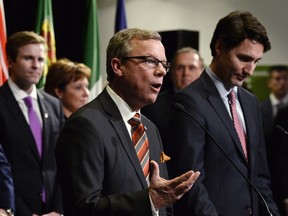 Saskatchewan Premier Brad Wall speaks following the family photo op during a First Ministers meeting at the Canadian Museum of Nature in Ottawa on Monday, Nov. 23, 2015.