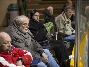 PJ Kennedy watches the game from a lawn chair at Rutherford Rink on the University of Saskatchewan campus on Oct. 31, 2015.
