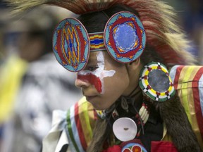 A dancer takes part in the opening ceremonies during the Federation of Saskatchewan Indian Nations Cultural Celebration & Pow wow at SaskTel Centre on Nov 15, 2015