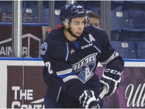 Saskatoon Blades right winger Connor Gay moves the puck against the Vancouver Giants during the third period of WHL action on Oct. 4, 2015.