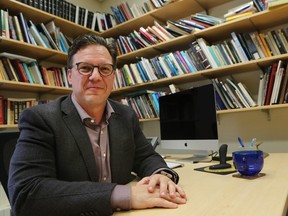 Johnson-Shoyama Graduate School of Public Policy professor Greg Poelzer in his office at the University of Saskatchewan.