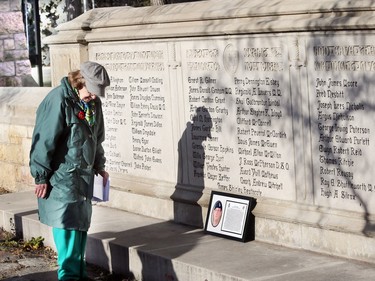 The annual Remembrance Day ceremony was held at the Memorial Gates on College Drive leading into Royal University Hospital on November 11, 2015. The Memorial Gates were erected in 1928 in honour of the 69 students, faculty and staff who perished in the Great War. Anne Moran checks out the names on the memorial.