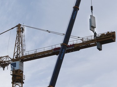 Construction of the Children's Hospital in Saskatoon is underway, November 17, 2015. Counterweights are added to a construction crane.