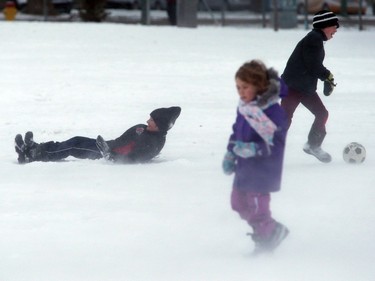 Students at Victoria School in the first snowfall in Saskatoon, November 18, 2015.