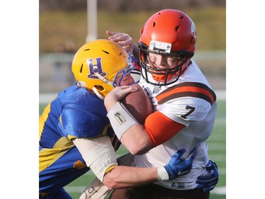 The Saskatoon Hilltops win their 18th national title 38-24 against the Okanagan Sun in Saskatoon, November 7, 2015. Hilltops' Cameron Schnitzler tackles Okanagan Sun's Cam Bedore.