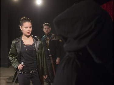 Kate Herriot performs as Macbeth (L), with Charlie Peters performing as Banquo during  media event for Macbeth by Embrace Theatre at AKA  gallery, November 1, 2015.