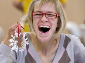 Tammy Stevens is having so much fun creating her snowflake christmas decoration for the 2015 City Hospital Foundation Festival of Trees at the WDM.