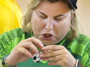 Morgan Schuler working on his soccer ball shaped christmas decoration at a afternoon of decorating with other Special Olympic Athletes  cutting, drawing and glueing hand made tree decorations before placing them on the tree bound for the 2015 City Hospital Foundation's Festival of Trees at the WDM, Nov. 12, 2015. All decoration represented the sports the participant are involved in. Volunteer parents and high school students from Holy Cross and Bishop James Mahoney High Schools also spent the afternoon helping out.