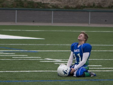 Saskatoon Bishop Mahoney Saints' Brock Matzner reacts to his team losing to the Moose Jaw Peacock Tornadoes in 3A Football Provincial finals at SMS field in Saskatoon, November 14, 2015.