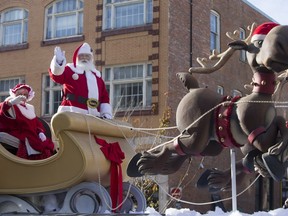 Santa Claus waves as the Santa Claus parade makes its way down Second Avenue North in Saskatoon, November 15, 2015.