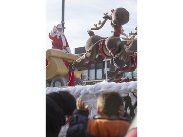 Santa Claus waves as the Santa Claus parade makes its way down Second Avenue North in Saskatoon, November 15, 2015.