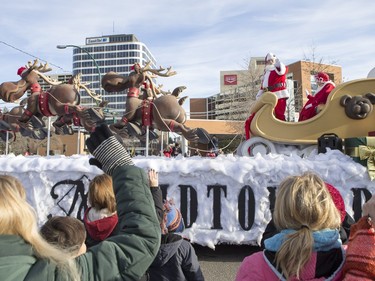 Santa Claus waves as the Santa Claus parade makes its way down Second Avenue North in Saskatoon, November 15, 2015.