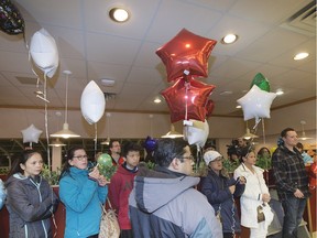 Mark McGregor was owner of the 22nd St Dairy Queen and some of his employees met at the restaurant to release balloons in honour of his death that occurred suddenly when he was stuck by a vehicle while out for a run earlier in the week, November 19, 2015.