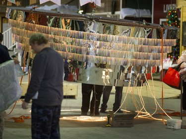 The Western Development Museum comes alive with the set-up for the annual Festival of Trees fundraiser for City Hospital, November 19, 2015. It seems like miles of rope lights are strung on the chandler before it's raised.