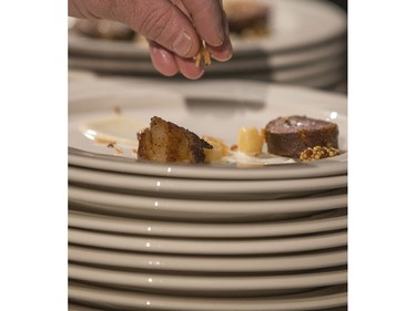 Darren Cradock prepares plates at the Gold Medal Plates Dinner, Canada's Best Kitchen Party. at Prairieland Centre, November 20, 2015.