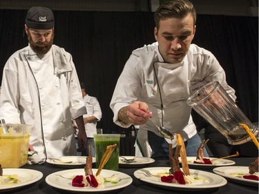 James Kyle prepares meals for the guests at the Gold Medal Plates Dinner at Prairieland Park, Friday, Nov. 20, 2015.