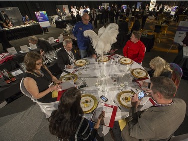 Judges taste, photograph and take notes on the food and wine at the Gold Medal Plates Dinner at Prairieland Park, Friday, Nov. 20, 2015.