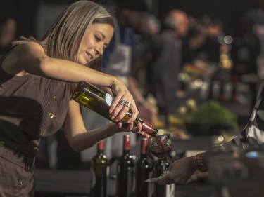 Red Rooster Wineries staff pours for guests at the Gold Medal Plates Dinner, Canada's Best Kitchen Party. at Prairieland Centre, November 20, 2015.
