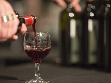 Red Rooster Wineries staff pours for guests at the Gold Medal Plates Dinner, Canada's Best Kitchen Party. at Prairieland Centre, November 20, 2015.