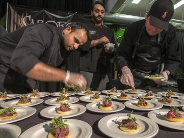 Sabroso's chefs tweaks their meal at the Gold Medal Plates Dinner, Canada's Best Kitchen Party. at Prairieland Centre, November 20, 2015.