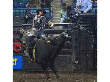 Cody Coverchuk rides the bull Nailed during the Professional Bull Riding PBR Canadian finals at SaskTel Centre in Saskatoon, November 21, 2015.