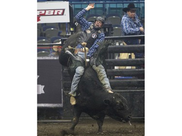 Jared Parsonage rides the bull Crooked Nose during the Professional Bull Riding PBR Canadian finals at SaskTel Centre in Saskatoon, November 21, 2015.