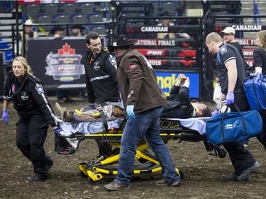 Stetson Lawrence is taken away on a stretcher after being bucked off the bull Clouds In My Coffee during the Professional Bull Riding PBR Canadian finals at SaskTel Centre in Saskatoon, November 21, 2015.