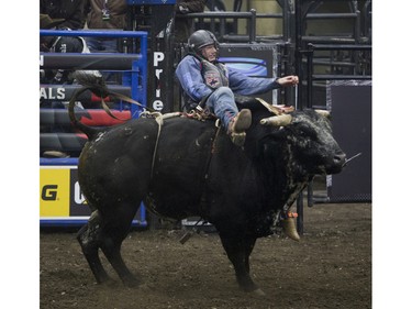 Tanner Byrne rides the bull Blue Stone during the Professional Bull Riding PBR Canadian finals at SaskTel Centre in Saskatoon, November 21, 2015.
