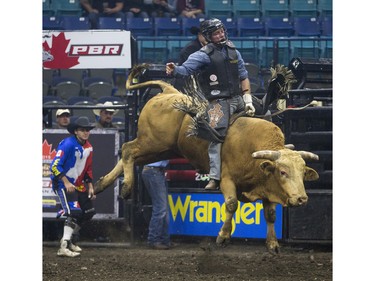Wacey Finkbeiner rides the bull Nugget during the Professional Bull Riding PBR Canadian finals at SaskTel Centre in Saskatoon, November 21, 2015.
