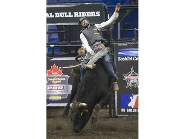 Zane Lambert rides the bull Come Closer during the Professional Bull Riding PBR Canadian finals at SaskTel Centre in Saskatoon, November 21, 2015.