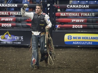 Zane Lambert celebrates after riding the bull Come Closer during the Professional Bull Riding PBR Canadian finals at SaskTel Centre in Saskatoon, November 21, 2015.
