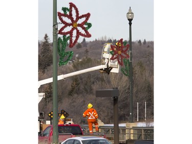 Traffic on the University Bridge was backed up for a few hours in the morning while civic employees installed Christmas decorations,   November 23, 2015.
