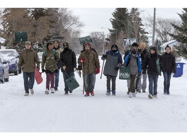 Josh Weibe's Wellness 10 class, with the help of intern Andrew Abbs, spent class shovelling snow off of sidewalks and driveways in the area of the 300 block of Avenues U and V North,   November 25, 2015.