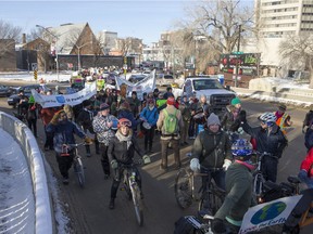 People walk down the Broadway Bridge during a march and rally for the climate called Saskatoon2Paris on Sunday, November 29th, 2015.