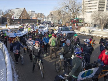 People walk down the Broadway Bridge during a march and rally for the climate called Saskatoon2Paris, November 29, 2015.