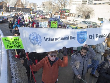 People walk down the Broadway Bridge during a march and rally for the climate called Saskatoon2Paris, November 29, 2015.