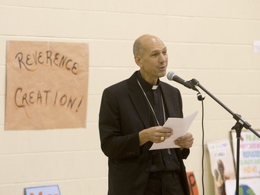 Roman Catholic Bishop Don Bolen speaks during a march and rally for the climate called Saskatoon2Paris, November 29, 2015.