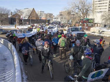 People walk down the Broadway Bridge during a march and rally for the climate called Saskatoon2Paris, November 29, 2015.