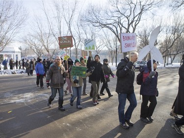 People walk down 20th Street East during a march and rally for the climate called Saskatoon2Paris, November 29, 2015.