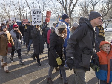 People walk down 20th Street East during a march and rally for the climate called Saskatoon2Paris, November 29, 2015.