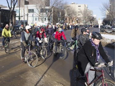 People walk down the Broadway Bridge during a march and rally for the climate called Saskatoon2Paris, November 29, 2015.