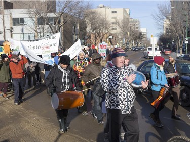 People walk down the Broadway Bridge during a march and rally for the climate called Saskatoon2Paris, November 29, 2015.