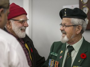 Korean War veteran Colin Clay spends time talking to the Muslim community after speaking at the Bait-ur-Rehmat Mosque.