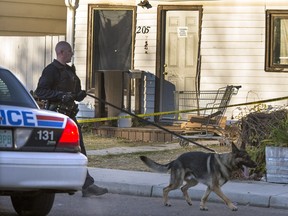 Saskatoon police investigate the scene of shooting at 205 Ave. J South on Oct. 10, 2014.